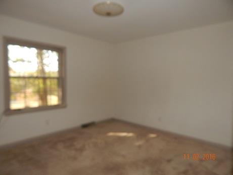 1116 Fall River Road Lawrenceburg, TN 38464 - Photo 12 of 16 an empty room with a window