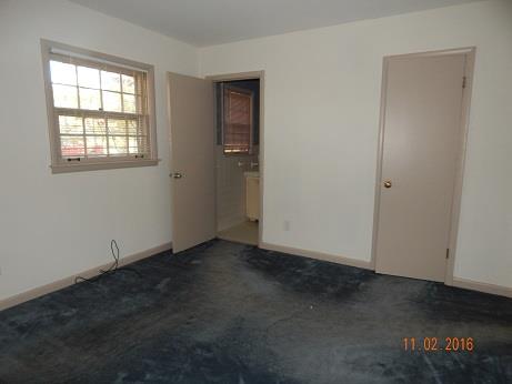 1116 Fall River Road Lawrenceburg, TN 38464 - Photo 13 of 16 an empty room with windows