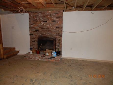 1116 Fall River Road Lawrenceburg, TN 38464 - Photo 14 of 16 a view of a room with rack and a fireplace