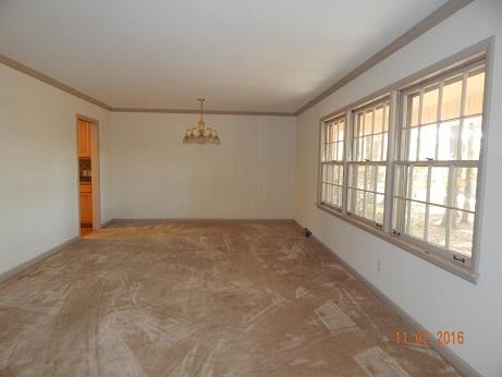 1116 Fall River Road Lawrenceburg, TN 38464 - Photo 5 of 16 a view of an empty room with a window