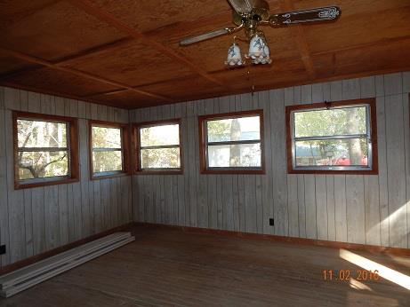 1116 Fall River Road Lawrenceburg, TN 38464 - Photo 8 of 16 a view of an empty room with a window