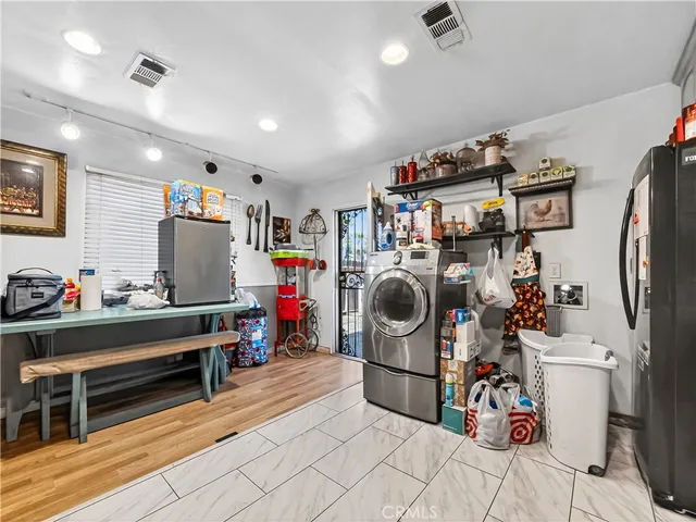 a kitchen with stainless steel appliances granite countertop a stove sink microwave and cabinets