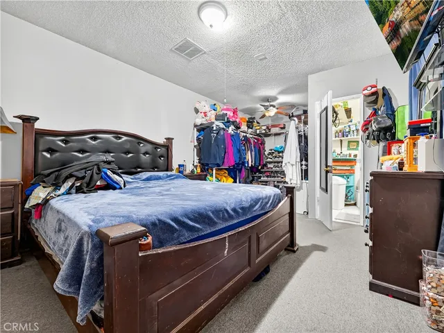 a bedroom with a bed and a closet