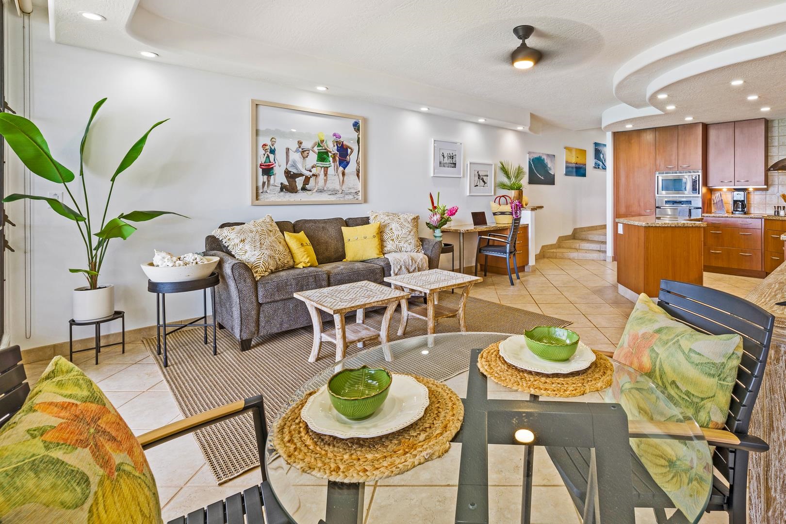 3875 Lower Honoapiilani Road, Unit B305 Lahaina, HI 96761 - Photo 22 of 35 a living room with lots of furniture and a dining table with wooden floor