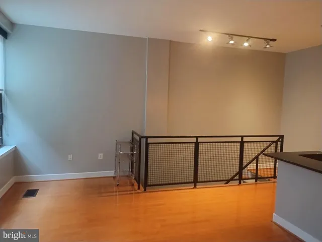 a view of an empty room with racks on the wall