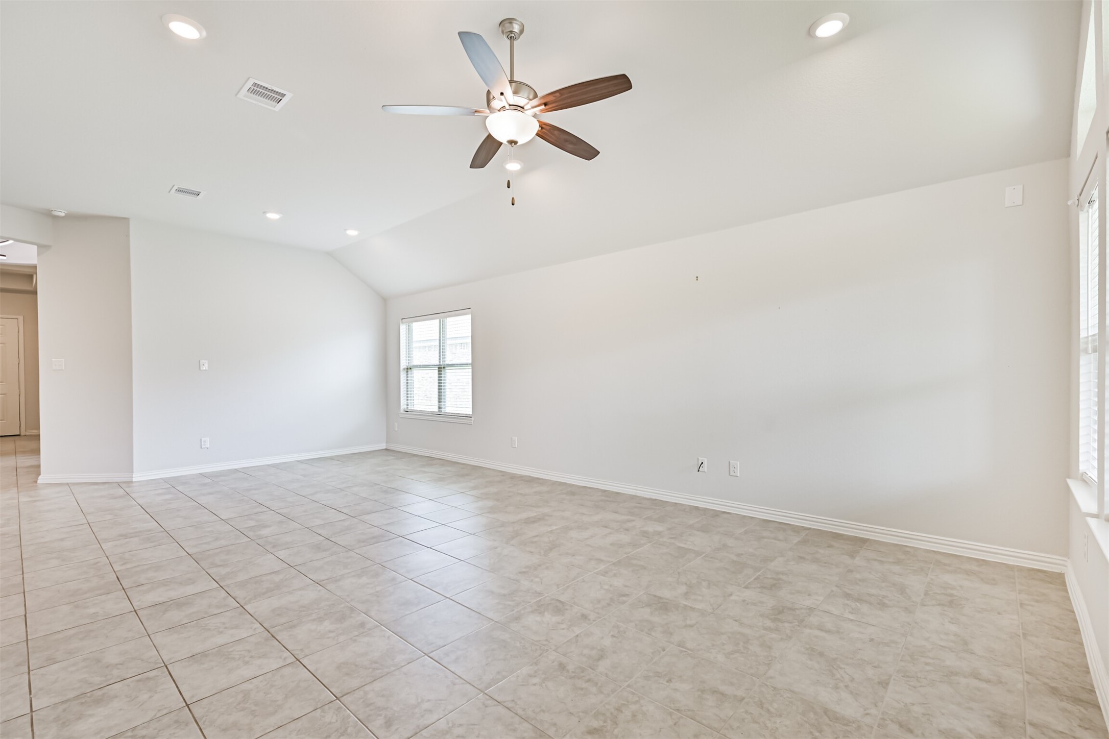 7019 Terra Drive Manvel, TX 77578 - Photo 16 of 41 an empty room with fan and windows