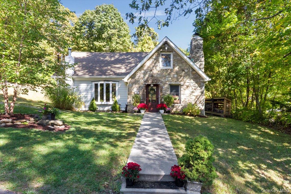 12 Philipse Road Carmel, NY 10512 - Photo 1 of 15 a front view of a house with a yard