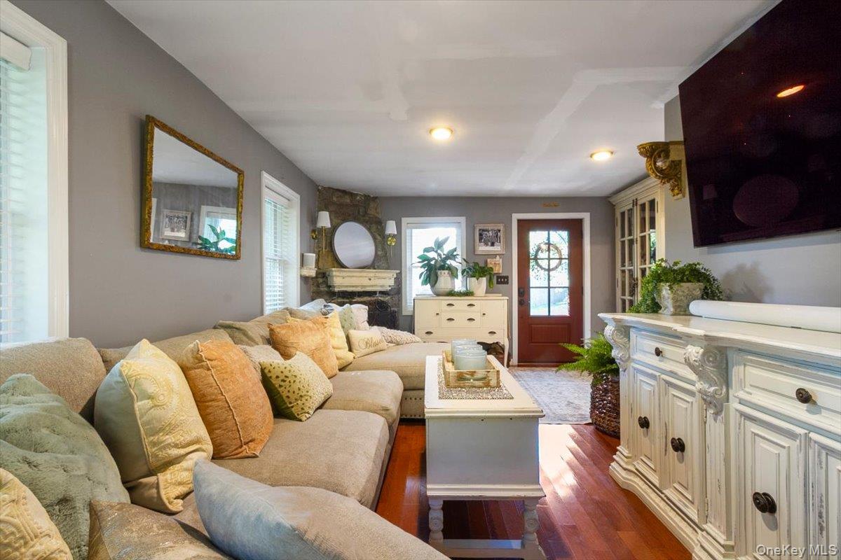 12 Philipse Road Carmel, NY 10512 - Photo 3 of 15 a living room with furniture fireplace and a flat screen tv
