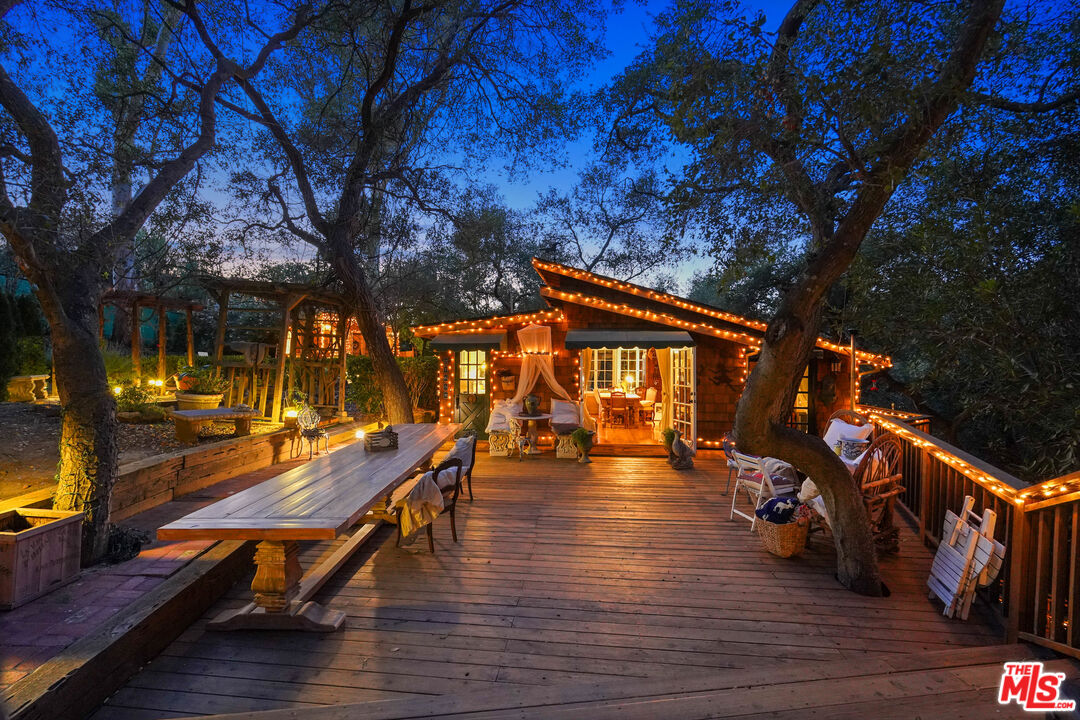 swimming pool view with a seating space