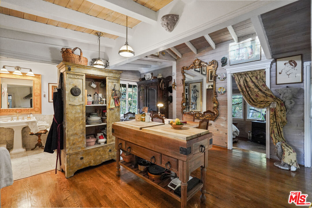 21658 Encina Road Topanga, CA 90290 - Photo 13 of 53 a living room with stainless steel appliances kitchen island granite countertop furniture and a flat screen tv