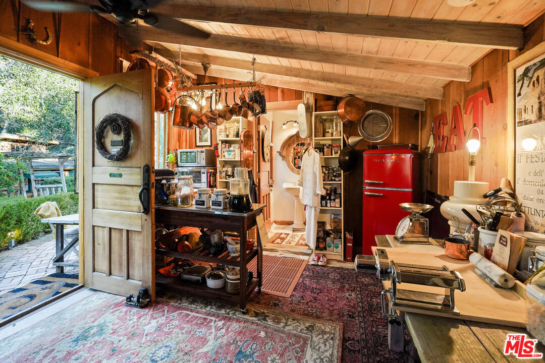 21658 Encina Road Topanga, CA 90290 - Photo 14 of 53 a room with lots of different colored cloths