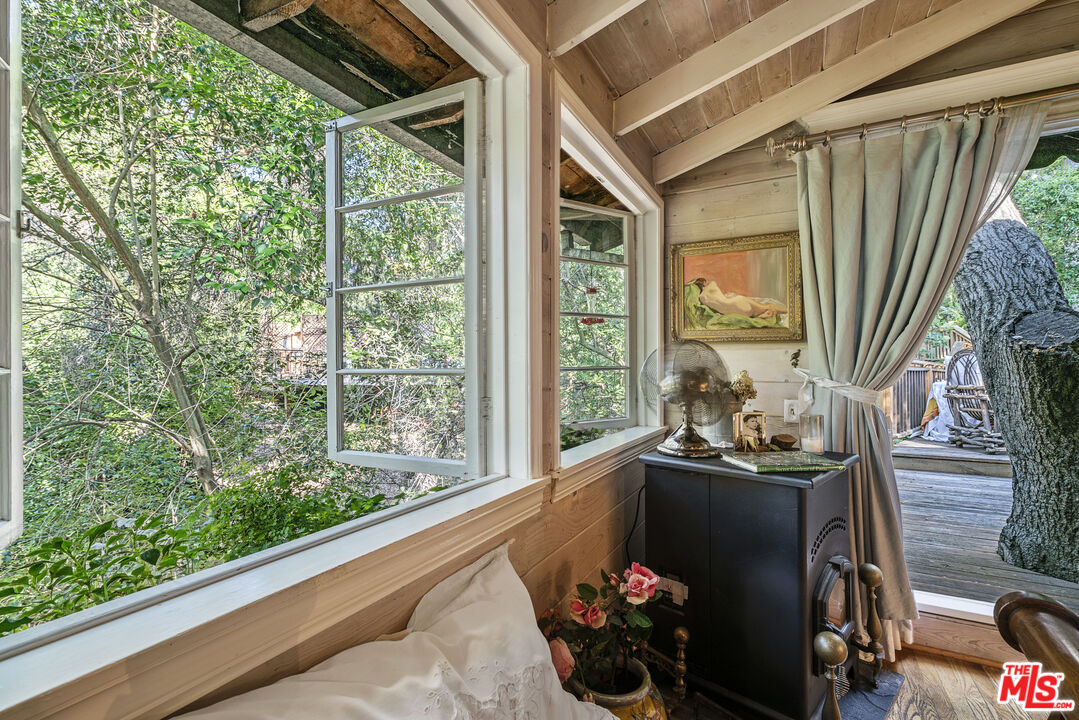 21658 Encina Road Topanga, CA 90290 - Photo 18 of 53 a front view of a house with garden