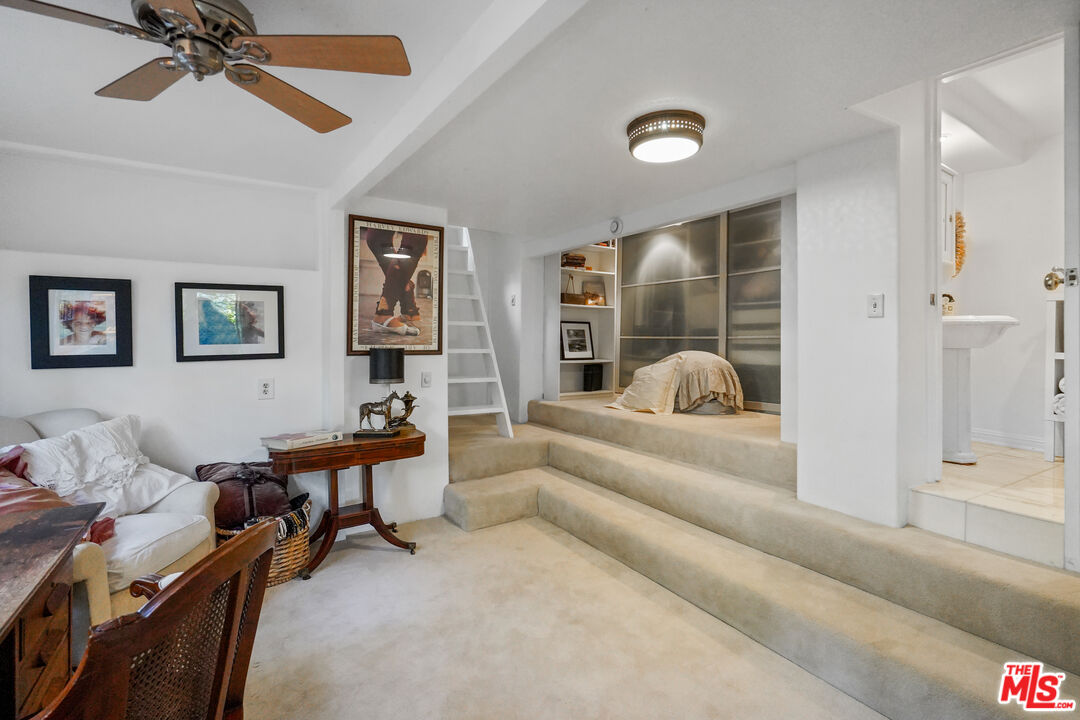 21658 Encina Road Topanga, CA 90290 - Photo 23 of 53 a living room with furniture and a large window