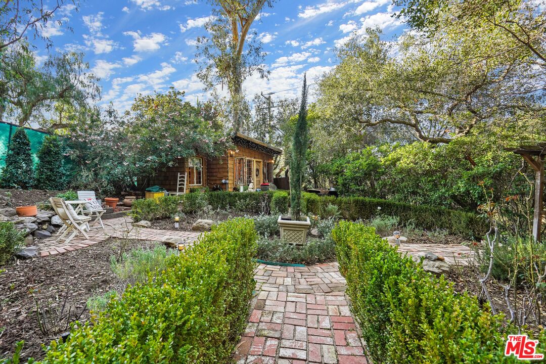 21658 Encina Road Topanga, CA 90290 - Photo 25 of 53 a view of backyard with sitting area and garden