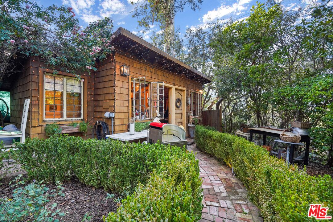 21658 Encina Road Topanga, CA 90290 - Photo 26 of 53 a front view of a house with porch