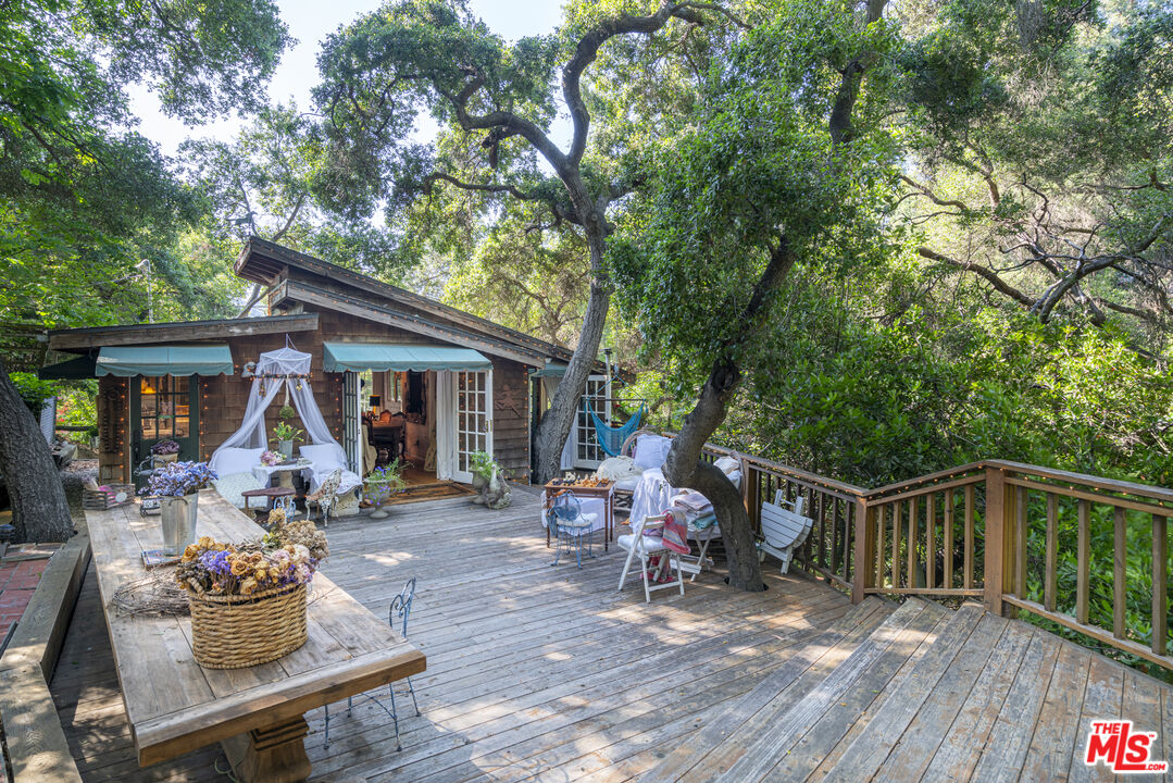 21658 Encina Road Topanga, CA 90290 - Photo 3 of 53 a front view of a house with seating space