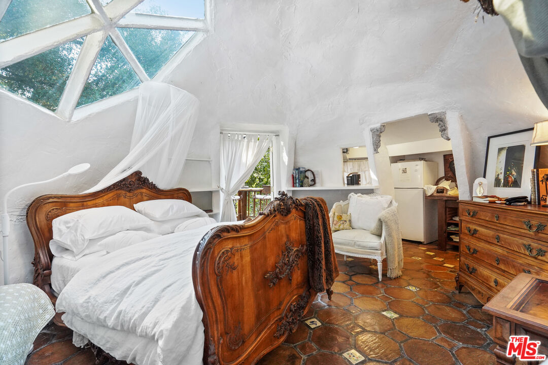 21658 Encina Road Topanga, CA 90290 - Photo 39 of 53 a bedroom with furniture and a wooden floor