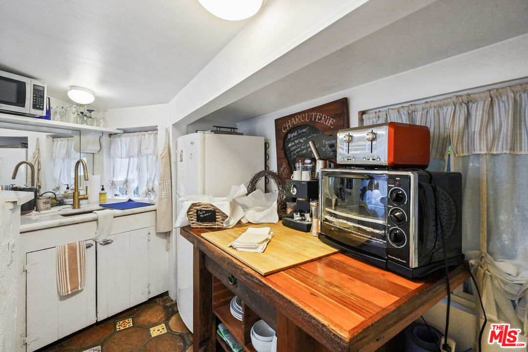 21658 Encina Road Topanga, CA 90290 - Photo 40 of 53 a room with storage and utility