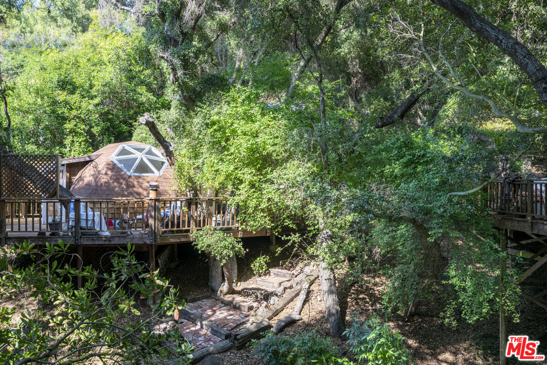 21658 Encina Road Topanga, CA 90290 - Photo 4 of 53 an aerial view of a house with a yard and large trees