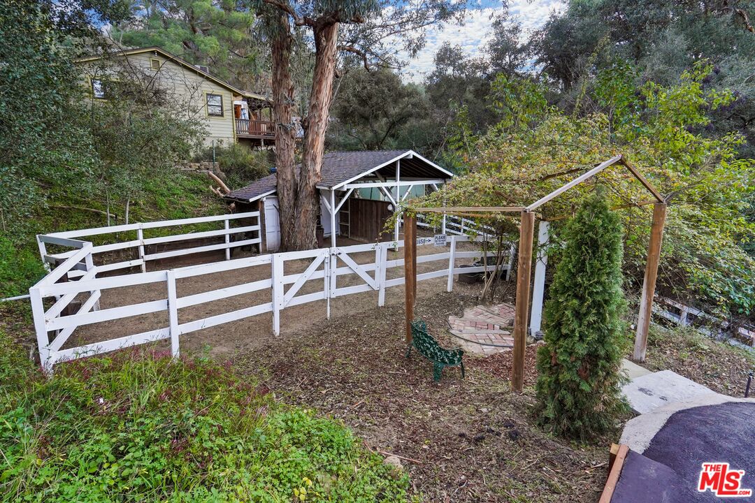 21658 Encina Road Topanga, CA 90290 - Photo 43 of 53 a view of a house with a yard