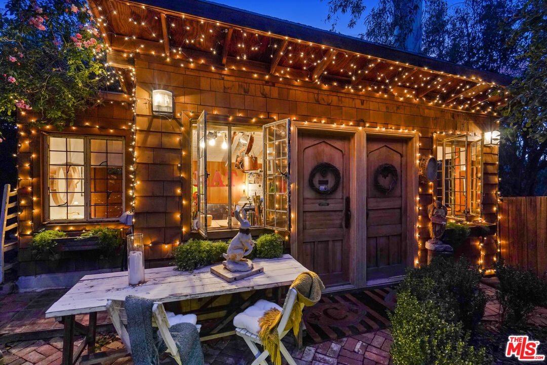 21658 Encina Road Topanga, CA 90290 - Photo 48 of 53 a view of an chairs and tables in patio