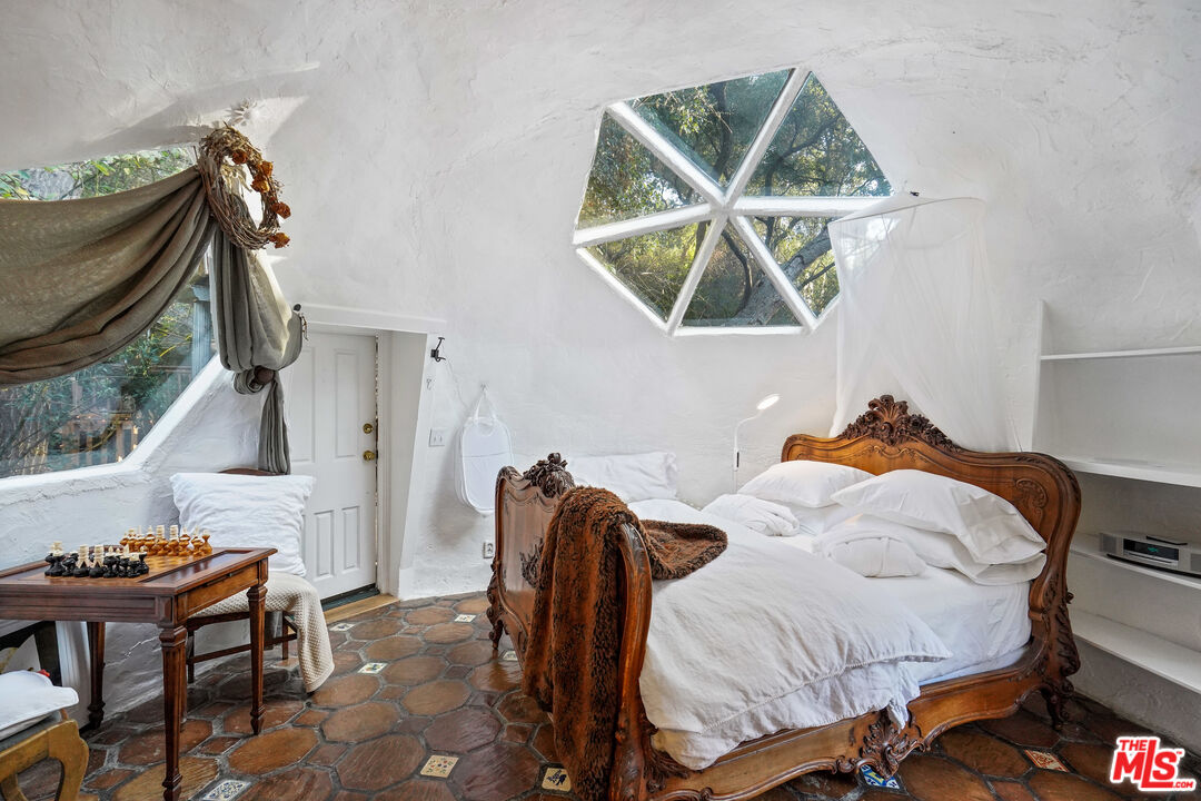 21658 Encina Road Topanga, CA 90290 - Photo 8 of 53 a bedroom with a bed and a window