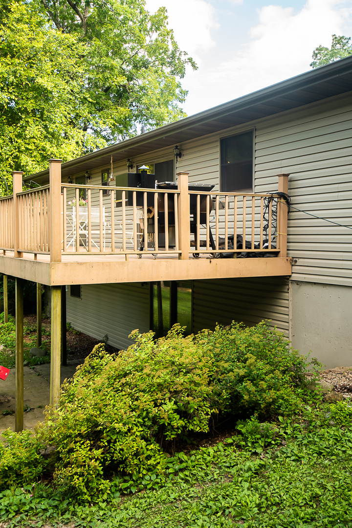 7830 Renee Rue Dixon, IL 61021 - Photo 23 of 25 a front view of a house with a yard and balcony