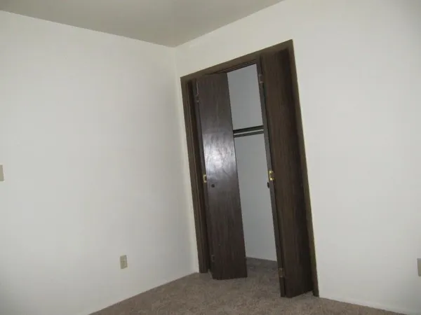 an empty room with closet