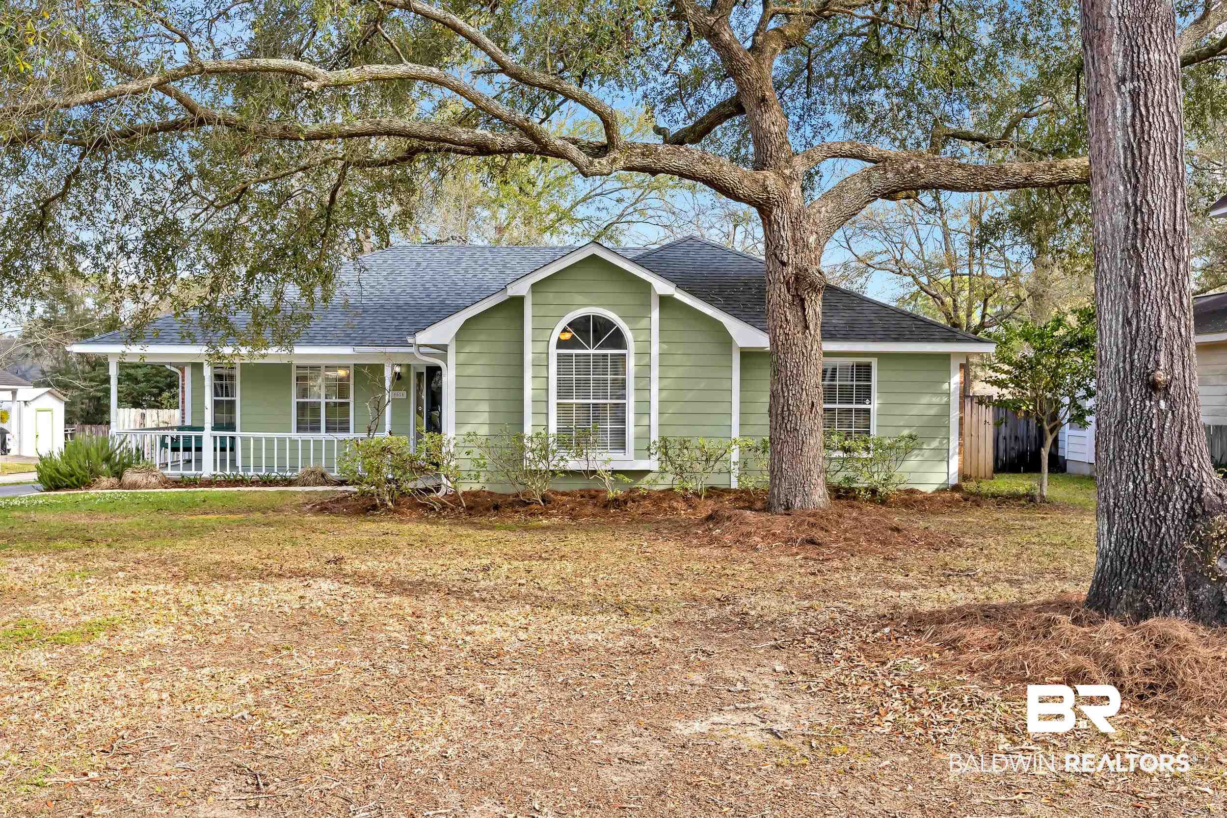 6616 Conde Court Mobile, AL 36695 - Photo 1 of 27 View of front of house featuring a front yard, covered porch, and a shingled roof