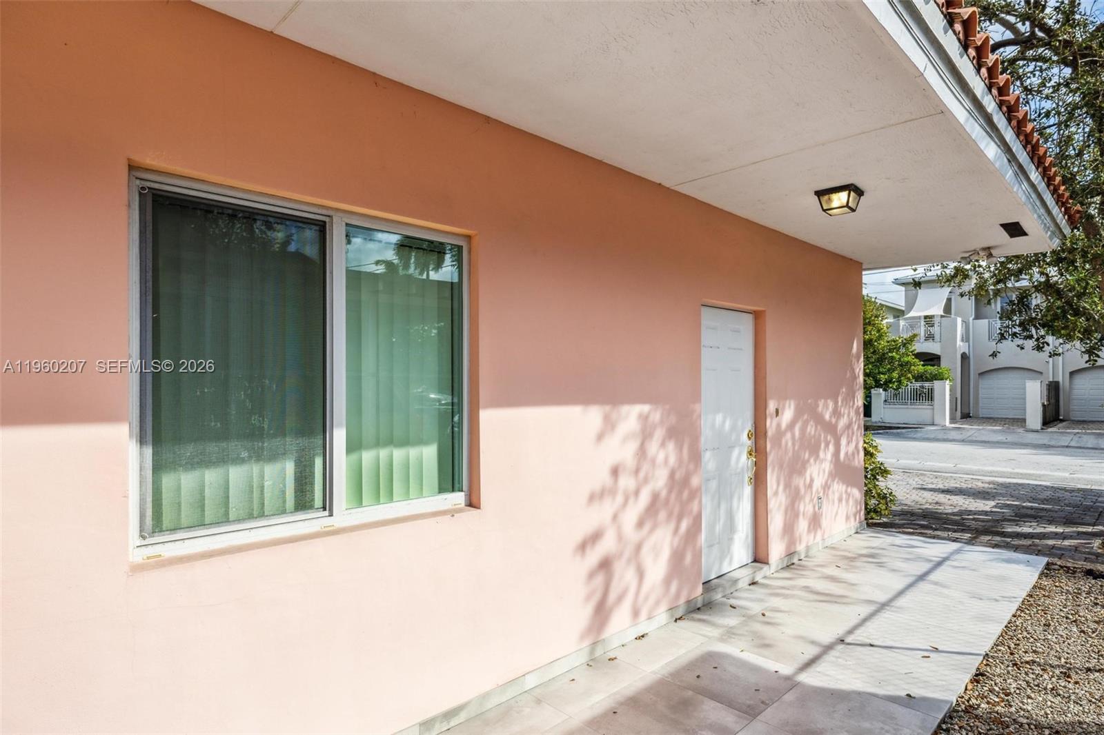 3134 Hibiscus Street Miami, FL 33133 - Photo 21 of 21 a front view of a house with a garden