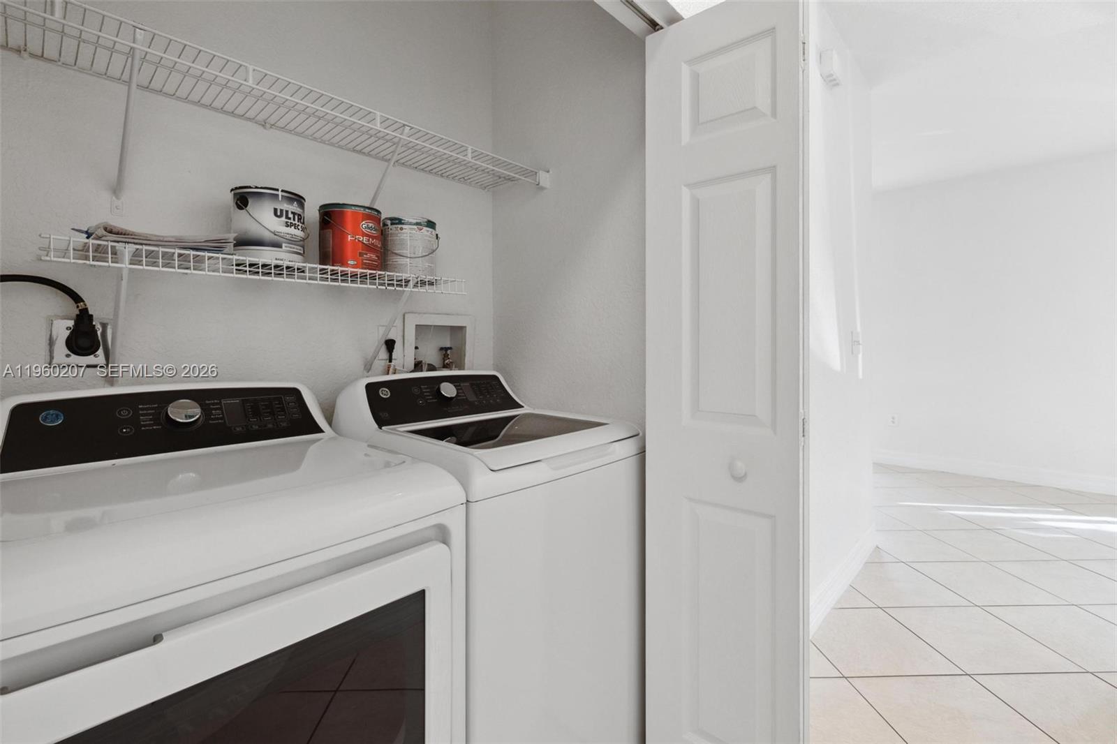 3134 Hibiscus Street Miami, FL 33133 - Photo 10 of 21 a view of storage and utility room with washer and dryer