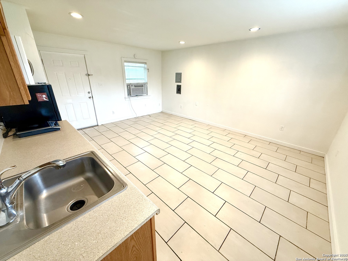 2614 Monterey Street, Unit 5 San Antonio, TX 78207 - Photo 12 of 12 a kitchen with a sink a stove and cabinets
