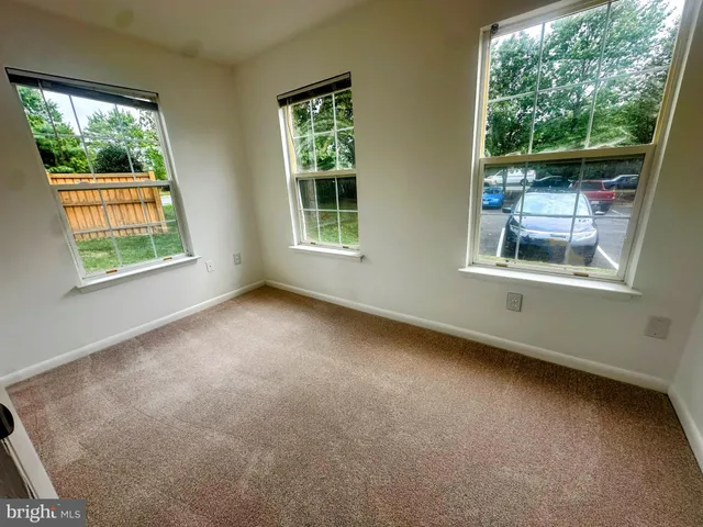 a view of empty room with windows