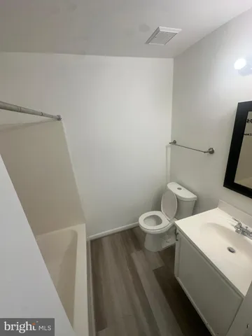 a kitchen with wooden cabinets and a stove top oven