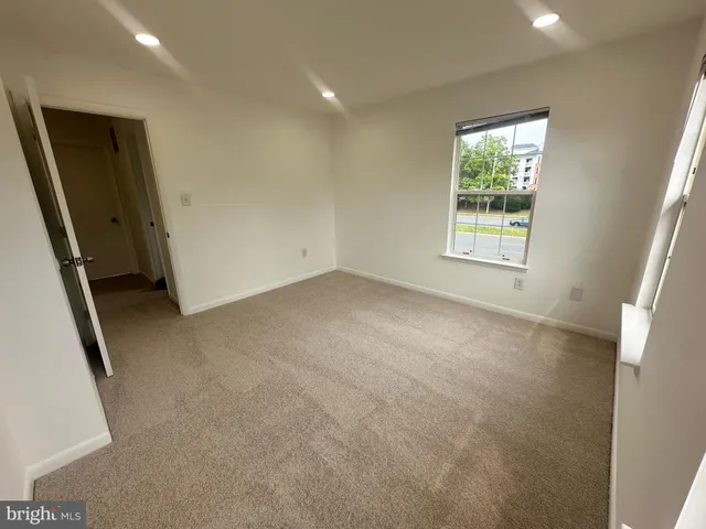a view of a swimming pool with outdoor seating