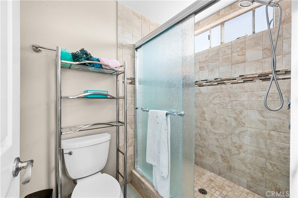 19465 Kinnow Lane Riverside, CA 92508 - Photo 28 of 61 a bathroom with a toilet and a shower
