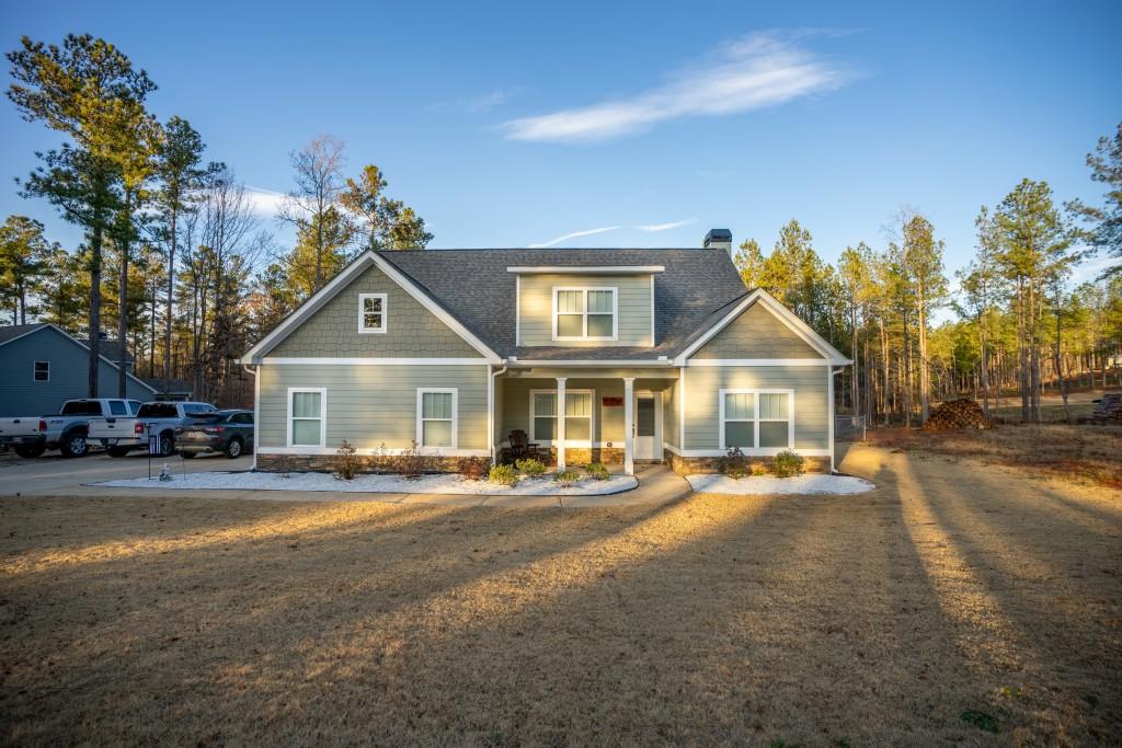 2242 Carson Segars Road Gillsville, GA 30543 - Photo 1 of 1 a front view of a house with a yard