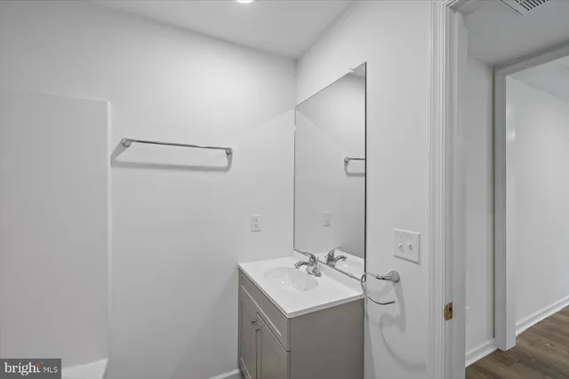 a bathroom with a sink toilet and vanity