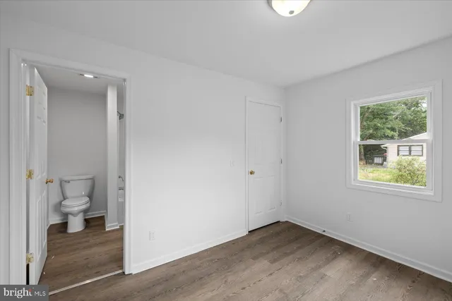 a view of a bathroom with a toilet sink and a window