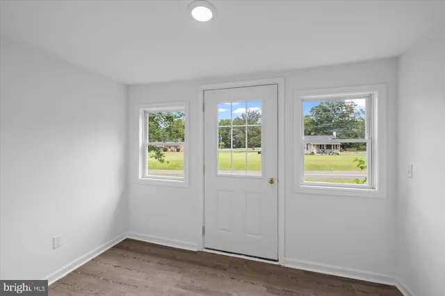 an empty room with windows