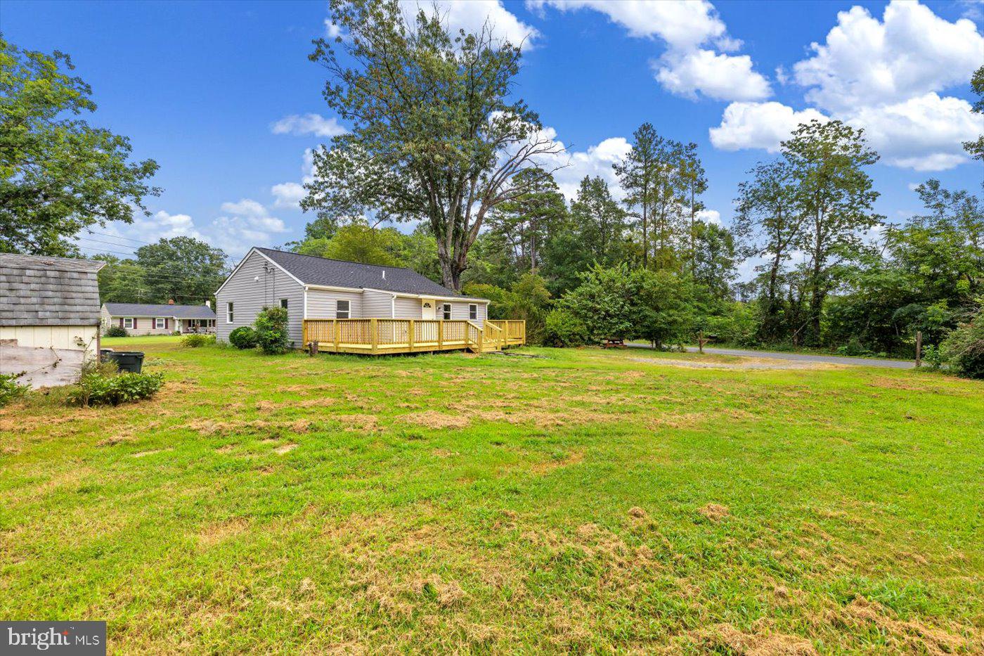 17287 Oakshade Road Orange, VA 22960 - Photo 23 of 26 a view of a swimming pool with an outdoor space and seating area