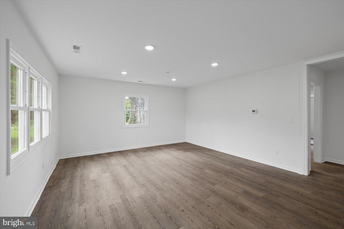 17287 Oakshade Road Orange, VA 22960 - Photo 3 of 26 a view of an empty room with wooden floor and a window
