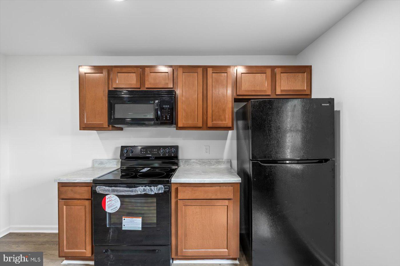 17287 Oakshade Road Orange, VA 22960 - Photo 8 of 26 a kitchen with a refrigerator and a stove top oven
