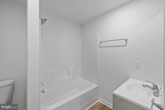 a bathroom with a sink and toilet