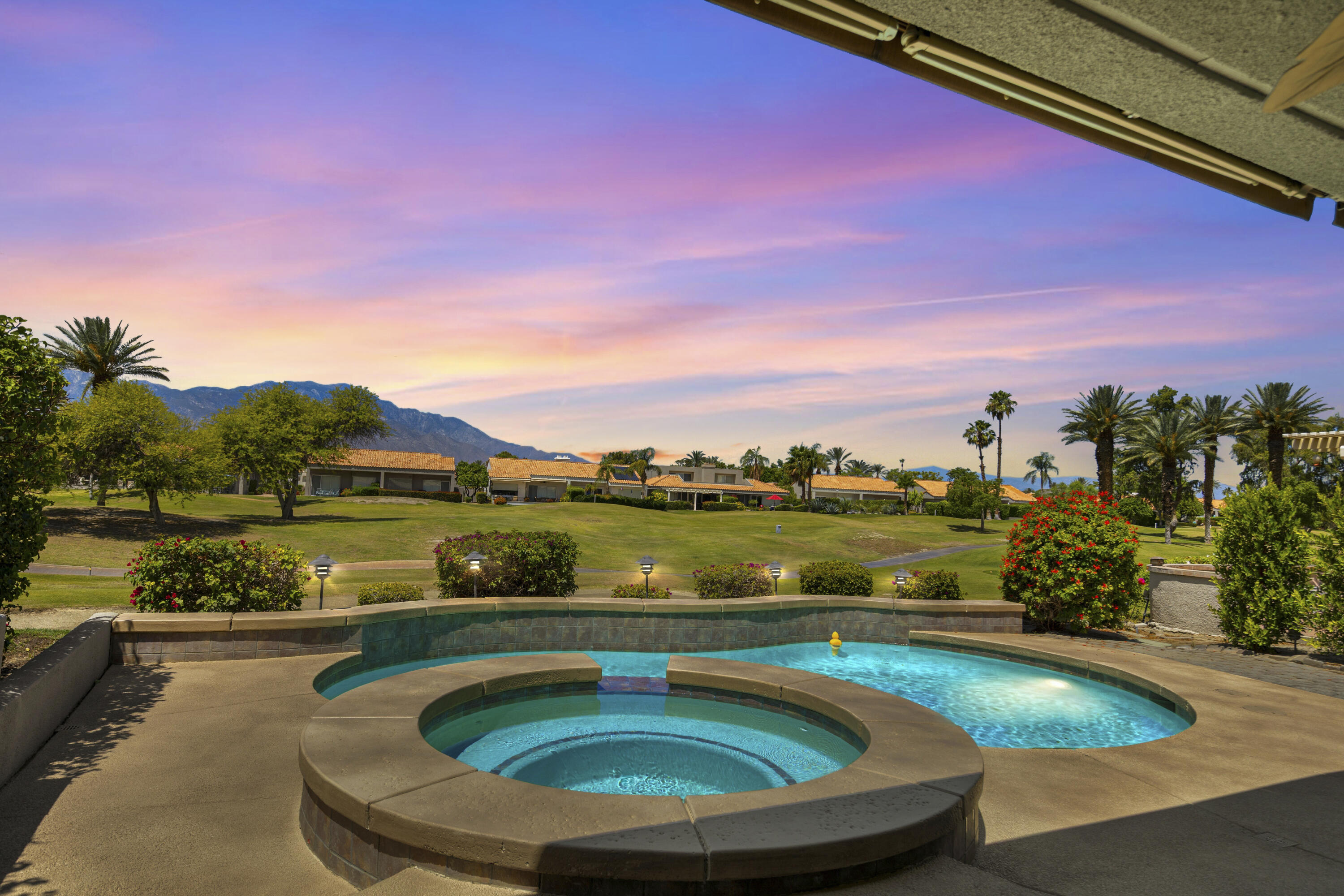 39 Augusta Drive Rancho Mirage, CA 92270 - Photo 45 of 53 a view of swimming pool with outdoor seating and lake