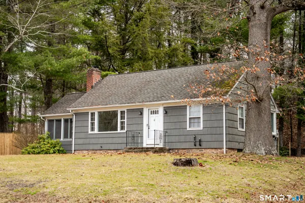 a house with trees in the background