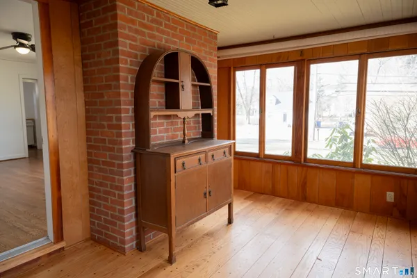 a view of kitchen with furniture and windows