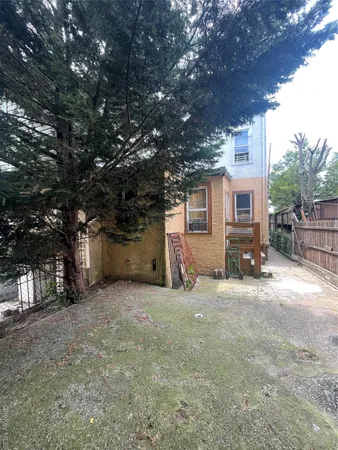 a front view of a house with parking space