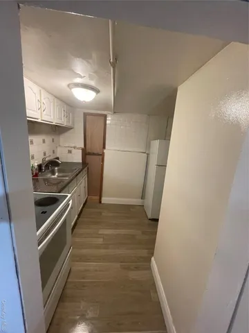 a bathroom with a sink and a washer dryer
