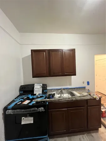 a kitchen with a stove and a microwave